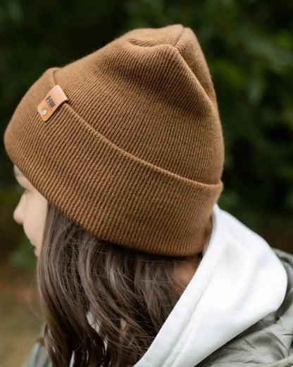 Camel brown beanie with folded cuff, side logo patch, worn from behind