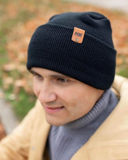 Charcoal black cuffed beanie with front logo patch, ribbed knit