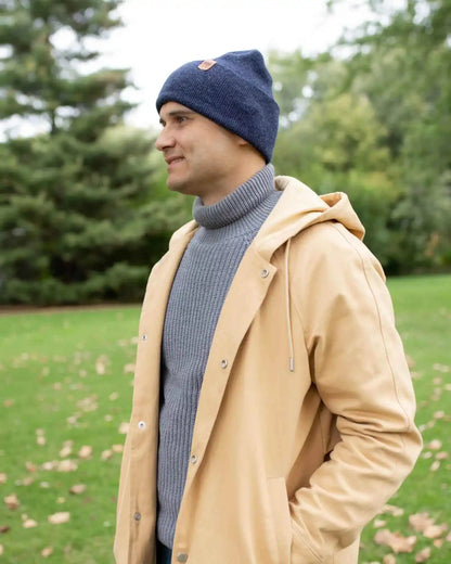Denim blue knit cuffed beanie with folded brim, solid color.