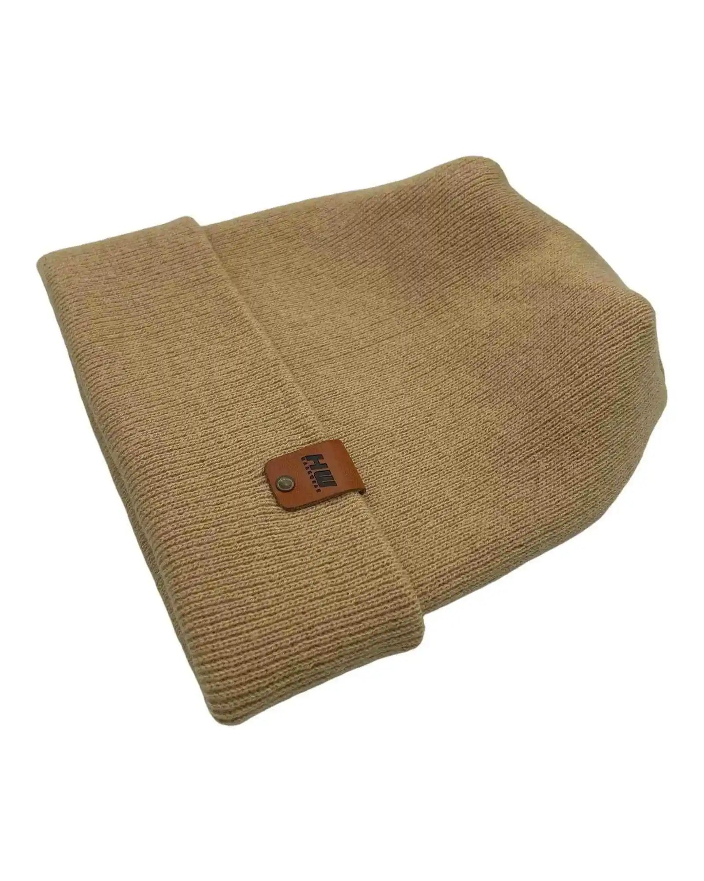 Folded cuff knit beanie in dune beige with square leather logo patch