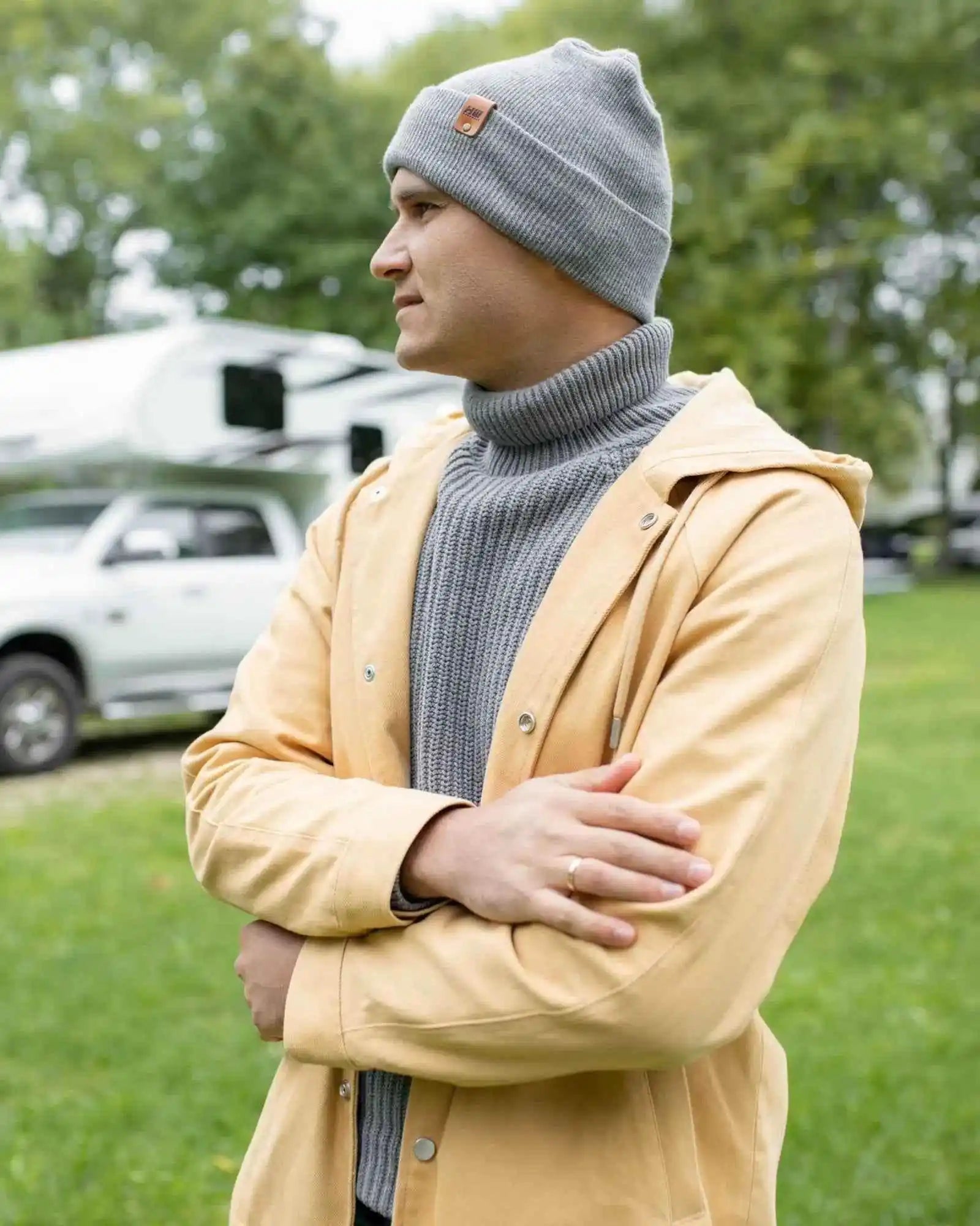 Koala gray knit beanie with folded cuff and small leather-look logo tag at side.
