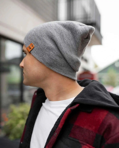 Gray beanie side view with logo patch on cuff and ribbed knit texture