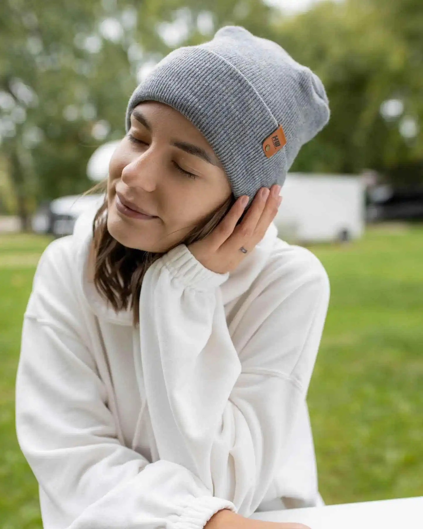 Koala gray ribbed knit cuff beanie with small logo patch, worn folded at top.