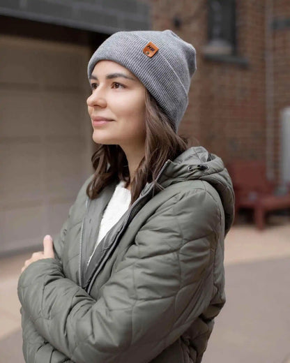 Gray cuffed beanie with foldover brim and small square logo patch