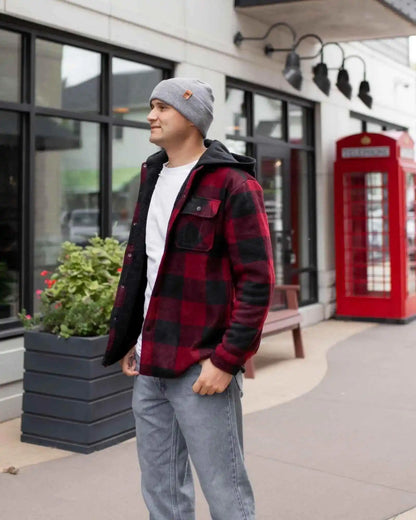 Koala gray ribbed cuff beanie on model, rounded knit crown with small logo patch.