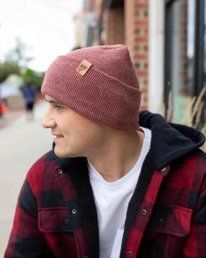 Rusty burgundy knit beanie with cuff and small logo patch on front