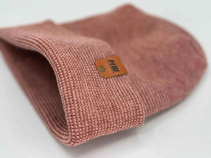 Cuffed burgundy beanie knit with woven texture and logo patch near cuff