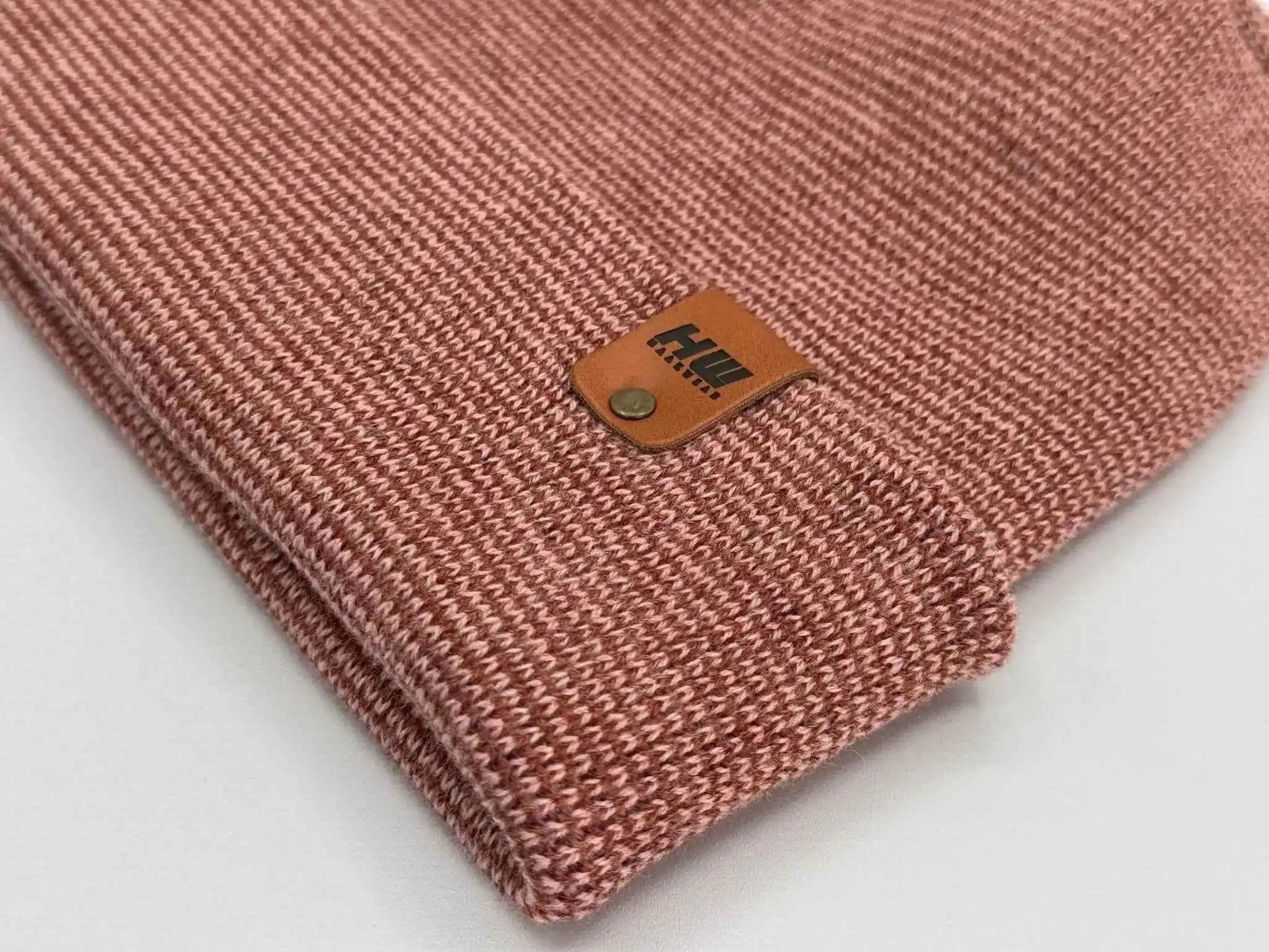 Burgundy cuffed beanie corner view with leather logo patch and knit texture
