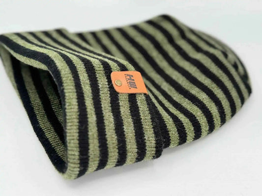 Cuffed knit beanie with black, green, and cream stripes; orange brand label