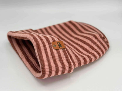 Folded cuff knit beanie with burgundy and pink stripes, turned-up brim, tag patch