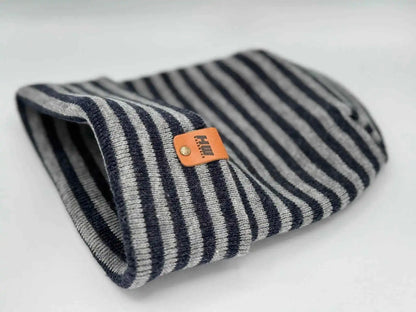 Striped cuffed beanie with folded brim and orange logo patch