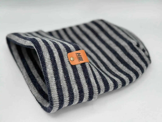 Striped cuffed beanie with folded brim and orange logo patch