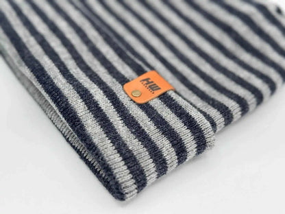 Striped cuffed beanie with orange logo patch on knit cuff
