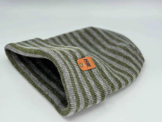 Gray and green striped cuffed beanie, rolled edge opening with orange logo patch