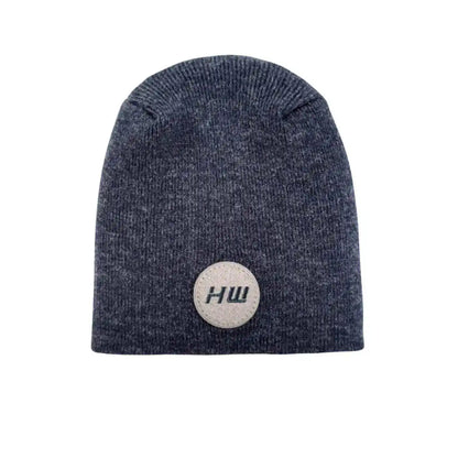 Denim blue knit beanie with un-cuffed ribbed edge and round HUI logo patch.