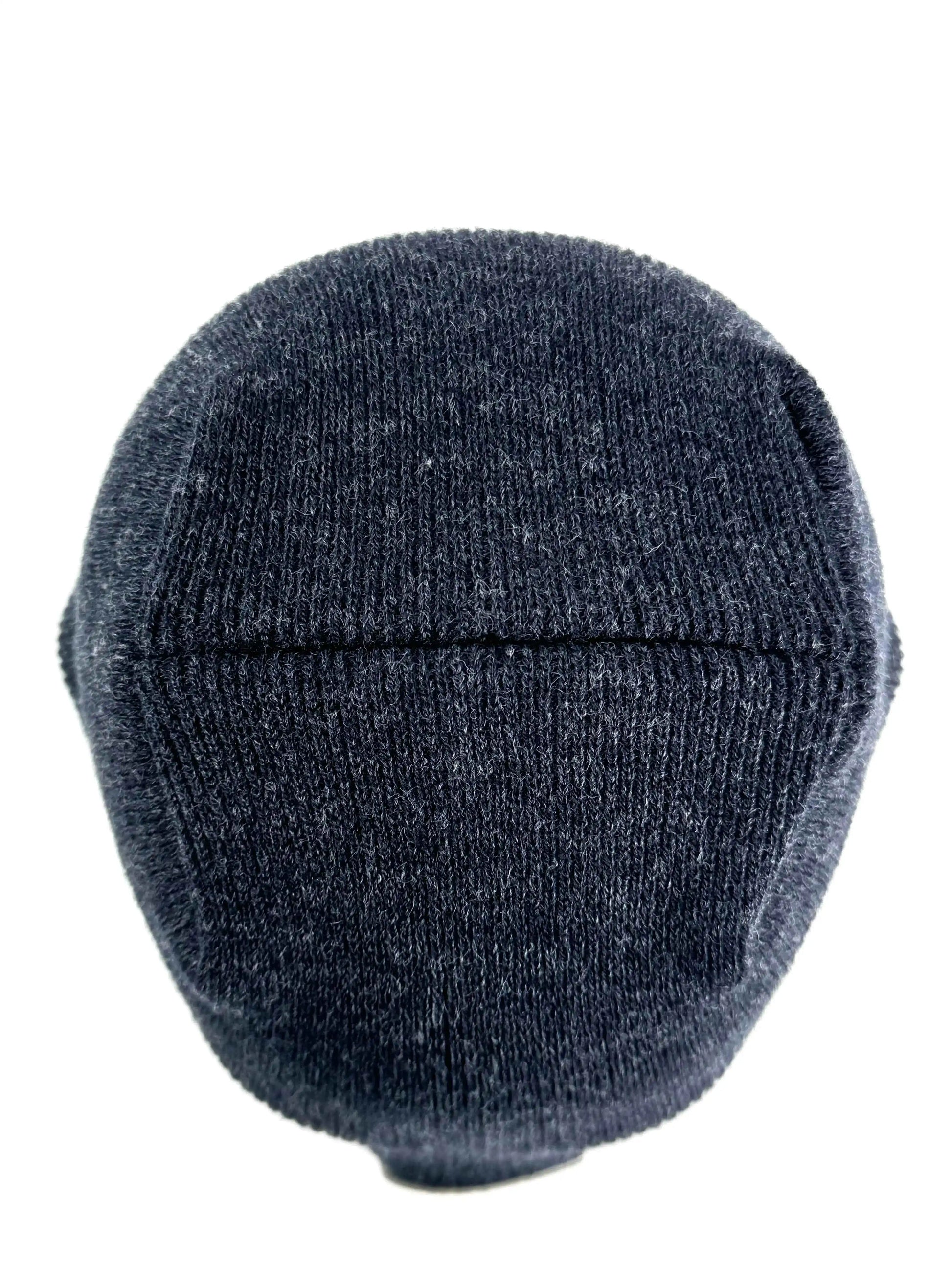 Denim blue knit beanie with ribbed crown and un-cuffed rolled edge.