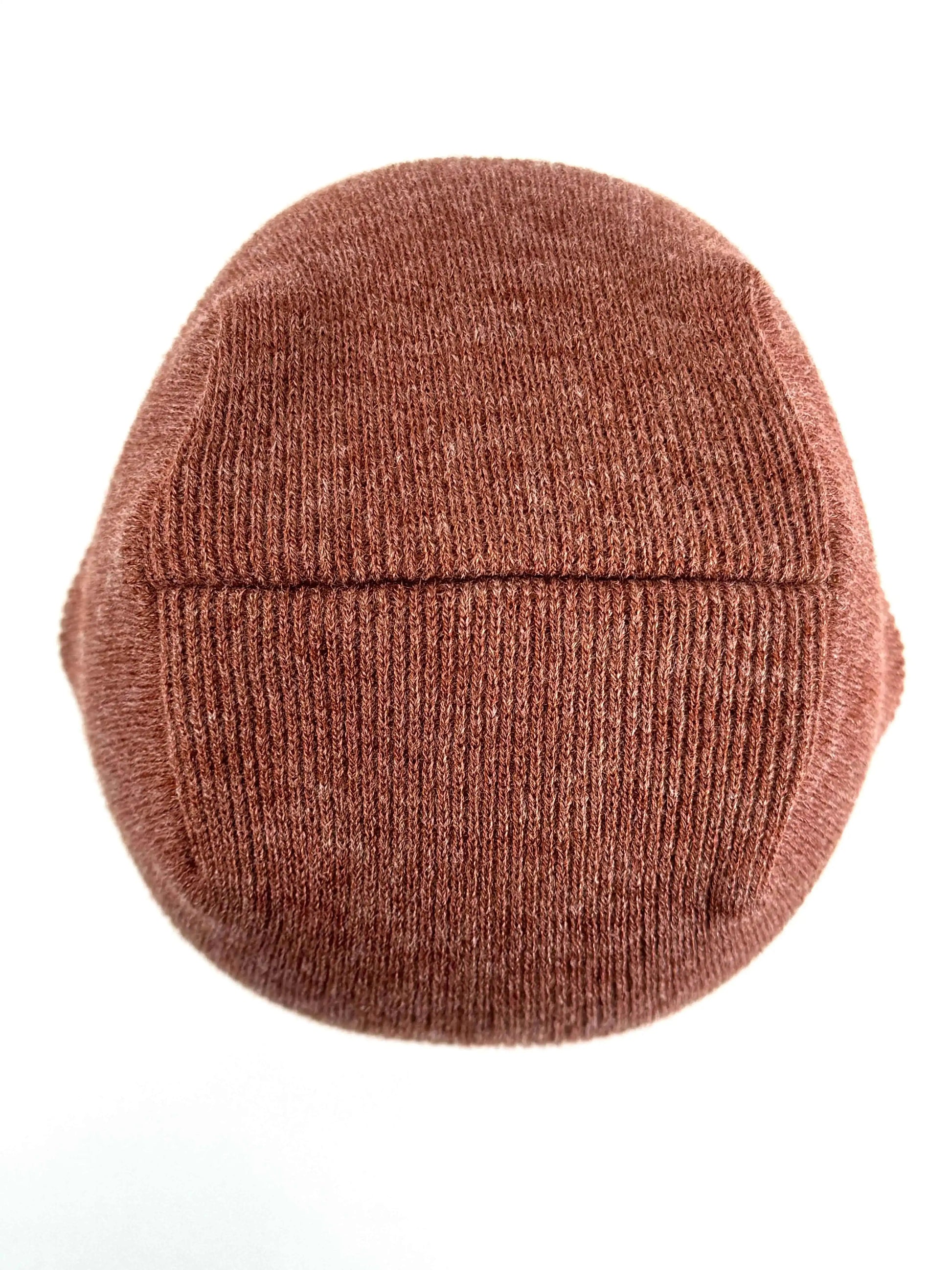 Burgundy knit beanie with ribbed texture, uncuffed look, simple stitched seam band