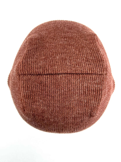 Burgundy knit beanie with ribbed texture, uncuffed look, simple stitched seam band