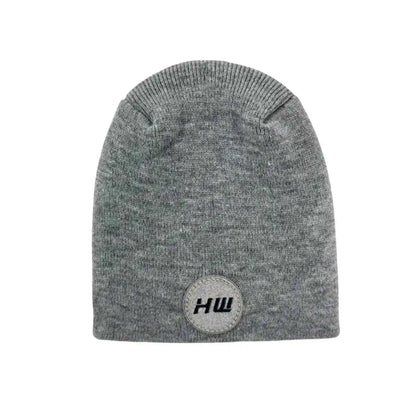 Gray knit beanie with un-cuffed ribbed edge and round HUI logo patch.