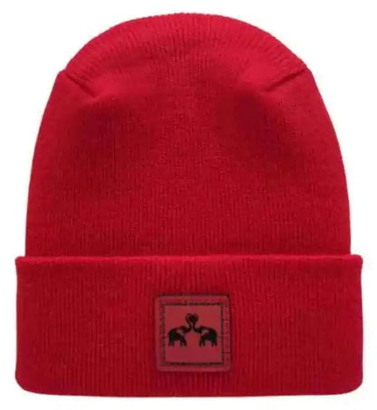Red knit beanie with square logo patch showing elephant silhouette