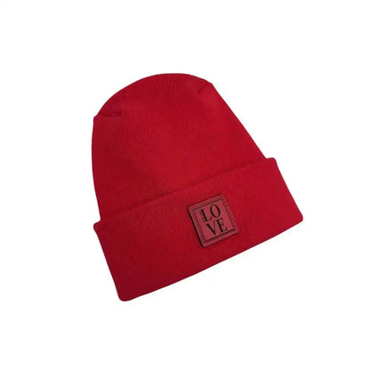 Red knit beanie with LOVE logo patch on side