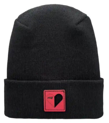 Black knit beanie with heart-shaped patch on cuff