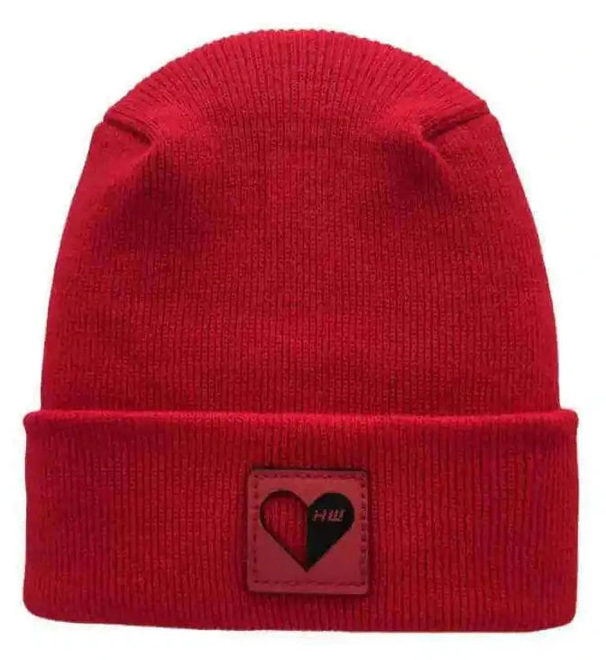 Red knit beanie with ribbed cuff and square heart logo patch